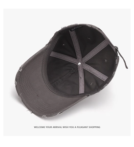 Detailed interior of vintage distressed baseball cap with metal buckle and stitching