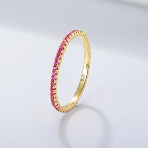 Detailed close-up of 925 sterling silver gold ring with inlaid pink zircon stones