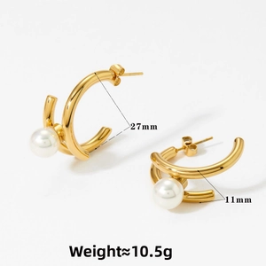 Detail view of 27mm gold C-shaped hoop earrings with pearls and 10.5g weight specs