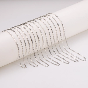 Minimalist silver rectangular link paperclip chain necklace on white pedestal display