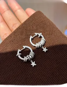 Close-up of S925 silver star tassel earrings with shimmering cubic zirconia accents