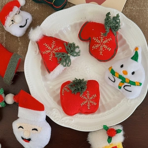 Miniature Christmas plush charms featuring Santa and Snowman for DIY bouquet decor