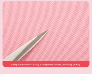 Detailed view of pink high-density fabric with scratch-resistant surface testing
