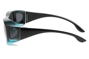 Detail view of wrap-around sunglasses with black temples and translucent teal frames