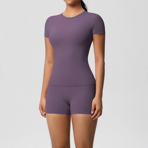 Detailed view of dark purple high-elastic yoga set with slim fit tee and shorts
