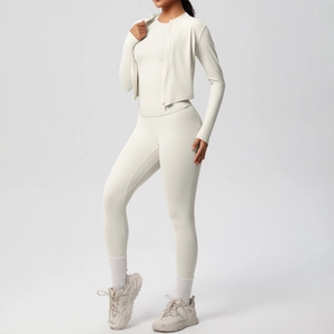 Three-piece cream yoga set with zip-up jacket, slim top and high-waist leggings