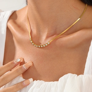 18K gold snake chain necklace with sparkling zircon curved pendant on female model