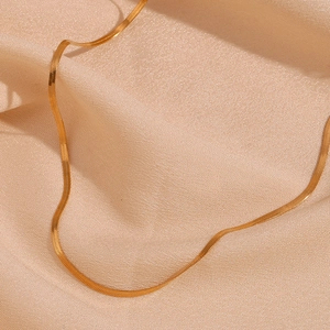 Detailed macro view of 2mm 18K gold plated stainless steel snake chain texture