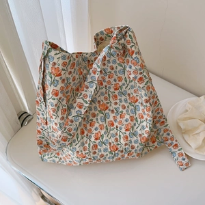 Close-up of floral cotton tote bag showing detailed pleats and nature-inspired prints