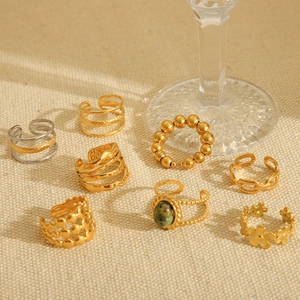 Collection of minimalist gold-plated stainless steel rings with gemstone and hammer texture