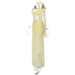 Close-up of pale yellow mesh dress with pleated texture and sheer fabric on mannequin