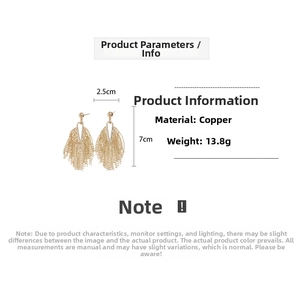 Detail view of gold layered tassel earrings with dimensions 2.5cm width and 7cm length