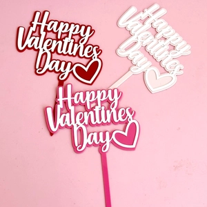 Three Happy Valentine's Day acrylic cake toppers in red and pink with heart designs