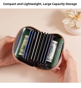 Pink accordion card holder showing large capacity slots with a gold zipper closure