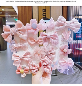 Detailed set of 14 pink children's hair clips featuring bows flowers and mesh designs