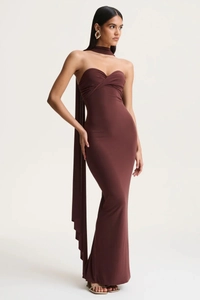Detail view of chocolate brown halter neck dress with twist bust and backless design