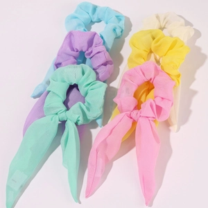 Close-up of pastel chiffon LED scrunchies with long ribbons in a colorful multi-pack set