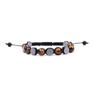 Macro detail of braided Tiger Eye stone beads with adjustable sliding knot and hematite accents