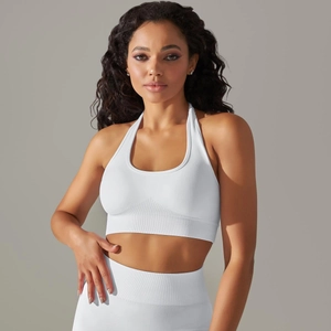 Detailed view of white seamless halter sports bra with ribbed underband and textured fabric