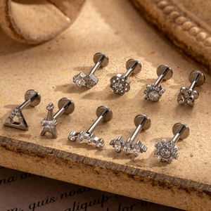 G23 titanium cartilage stud set with clear zircon in various shapes on cork