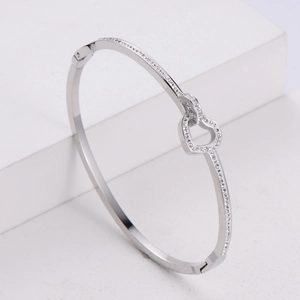 Polished silver heart-shaped stainless steel bracelet with sparkling micro-pave crystals