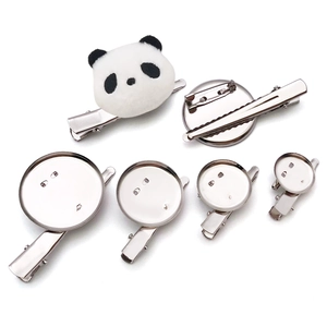 DIY brooch bases and panda plush clip accessories on a clean white background