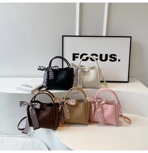 Group display of chic PU leather bucket bags in five colors with silk scarf handles