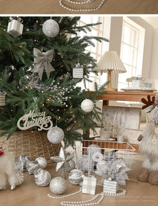 Silver Christmas tree ornament set featuring glittery bows, star topper and festive signs