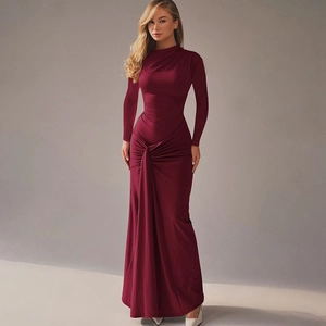 Detail of waist knot and ruched design on a slim fit burgundy long sleeve maxi dress