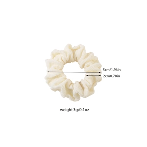Elastic beige waffle knit hair scrunchie with 5cm diameter and durable stretch design