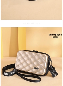 Close-up of champagne mini hardshell crossbody bag with textured diamond pattern
