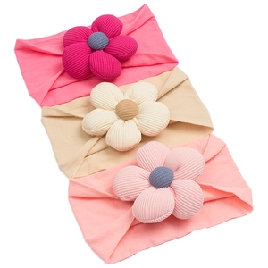 Three-piece set of baby nylon headbands featuring soft textured 3D fabric flowers