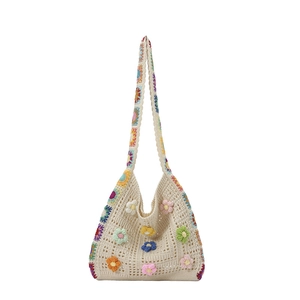 Handmade crochet beach tote bag with colorful 3D flowers and wide shoulder straps