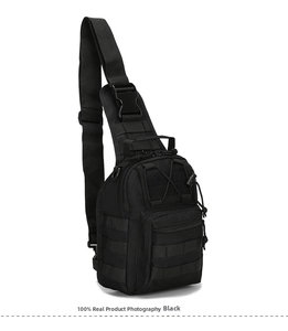 Detail of black tactical chest bag showing durable nylon material and molle webbing