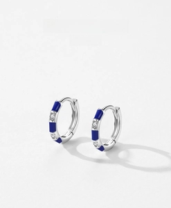 Detail of S925 sterling silver hoop earrings with blue enamel and zircon inlay
