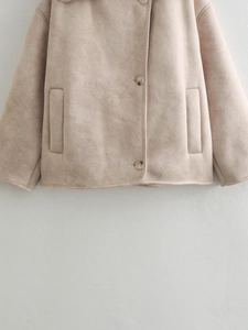 Detail of beige faux suede jacket showing the soft texture and premium fleece lining