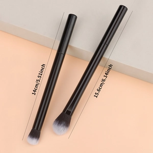 Detailed view of two makeup brushes with black handles and size markings in cm and inches