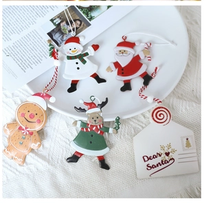 Set of metal Christmas ornaments with Santa, snowman and Dear Santa letter on white tray