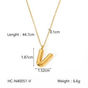 Detail view of puffy gold letter V necklace showing dimensions 1.87cm height and 44.7cm length