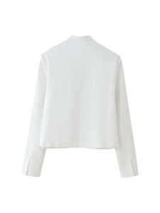 Detailed back view of white stand collar jacket featuring high density textured fabric