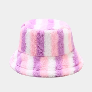 Close-up of fuzzy rainbow striped bucket hat showing soft pink and purple faux fur texture