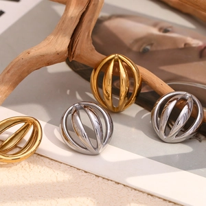 Detailed macro view of 18K gold and silver plated hollow cage stud earrings