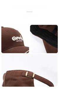 Detail view of the deep brown cotton fabric and vintage brass buckle on baseball cap