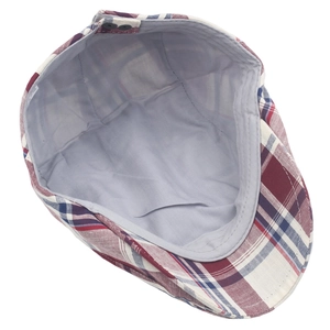 Detail view of the red and blue plaid ivy cap showing breathable lining and adjustable buckle