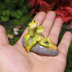 Miniature frog couple figurine on pebble for fairy garden and succulent decor