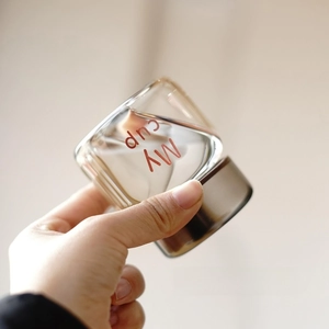 Detail of sealed square glass bottle with My cup text showing leakproof performance