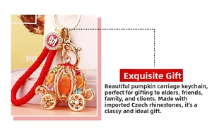 Macro detail of pumpkin carriage keychain with colorful rhinestones and gold-tone finish