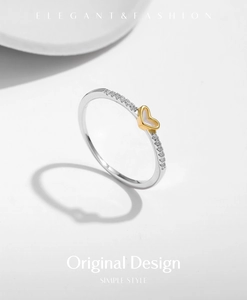 Close-up of s925 silver ring featuring a heart mother-of-pearl and inlaid diamonds