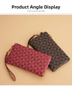 Detail view of red and brown geometric purses with wrist straps and gold zippers