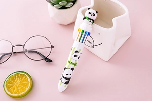 Creative panda multi-color ballpoint pen on desk with cute stationery accessories